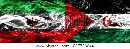Iran Vs Sahrawi Smoke Flags Placed Side By Side. Thick Colored Silky Smoke Flags Of Iranian And Sahr