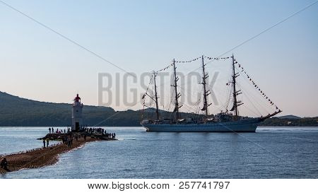 The Movement Of Sailing Ship Aiwo Maru In The Amur Bay Of The Bosporus Easern Strait In The Backgrou