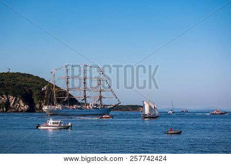The Movement Of Sailing Ship Aiwo Maru In The Amur Bay Of The Bosporus Easern Strait In The Backgrou
