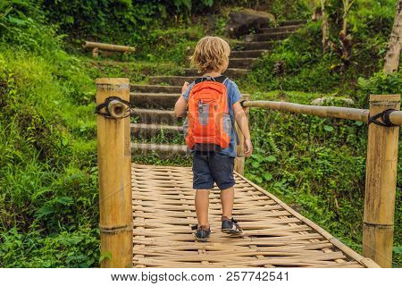 Boy Traveler On Beautiful Jatiluwih Rice Terraces Against The Background Of Famous Volcanoes In Bali