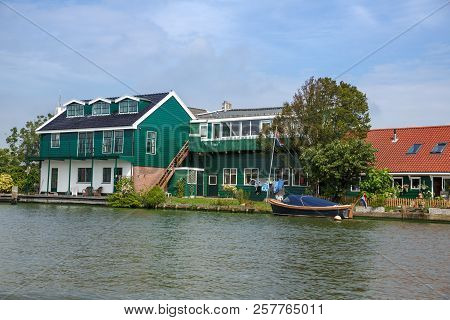 Zaanse Schans Village With River And Houses In The Netherlands.