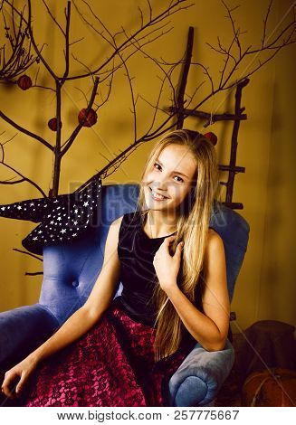 Young Pretty Teenage Girl In Halloween Holiday Decorated Interio