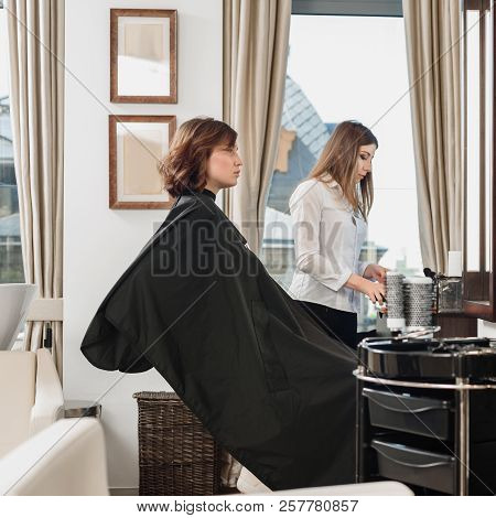 Professionsl Visagist Working With Young Woman In Beauty Salon