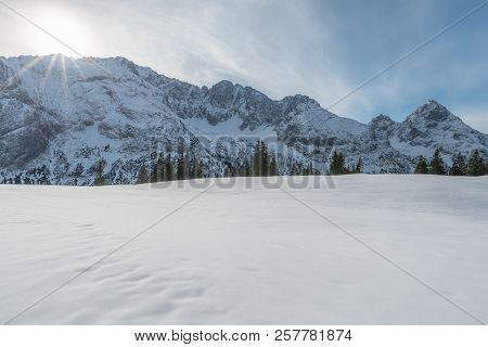 Winter Landscape With The Austrian Alps With Snow-capped Peaks And A Snowy Valley, On A Sunny Day In