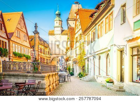 Marcus Tower With Medieval Fountain And Roderbogen Arch In Rothenburg Ob Der Tauber, Germany, Retro 
