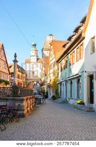 Marcus Tower With Fountain And Roderbogen Arch, Street In Rothenburg Ob Der Tauber, Germany