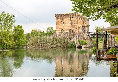 Ruin Of Tower At Visconteo Bridge Coasted By River Mincio, Borghetto, Verona, Italy.