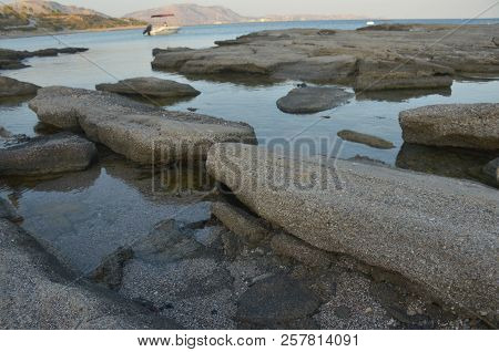 Large Rocks On The Ocean In The Water