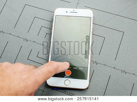 Paris, France - Sep 26, 2016: Male Hand Holding New Apple Iphone 7 8 Plus Smartphone After Unboxing 