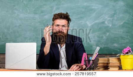 Pay Attention To Details. Teacher Listening Answer Or Report. Teacher Formal Wear Sit Table Classroo