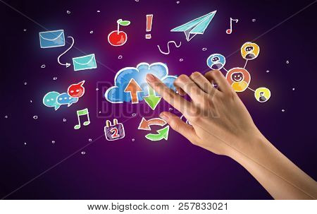 Female hand toucing mixed media icons with purple background