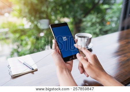 Chiang Mai, Thailand - August 18,2018: Woman Hands Holding Huawei Mobile Phone With Linkedin Applica