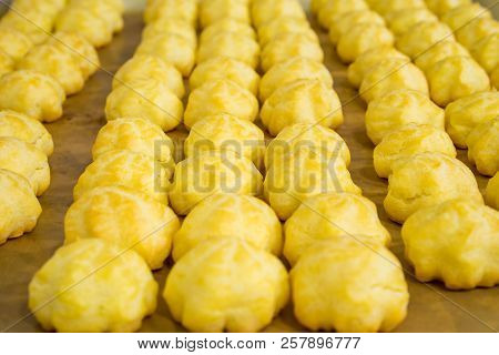 Cream Puffs Olso Known As Eclair In Tray.