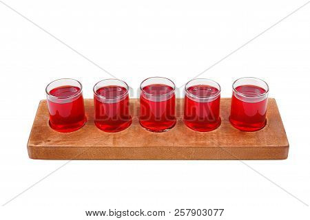 Red, Same Color Transparent Cocktails, A Set Of Shots In One Row, Five Servings On A Wooden Stand, S