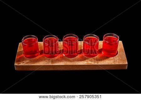 Red, Same Color Transparent Cocktails, A Set Of Shots In One Row, Five Servings On A Wooden Stand, S