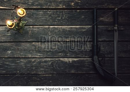 Musket Gun And Dagger Knife On Wooden Table Background With Copy Space.