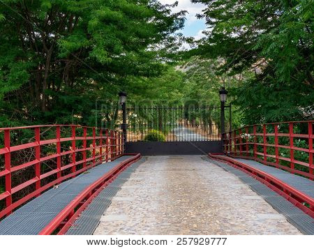 Redbridge Over The River Henares With Red Pads And Stone Floor For Entrance To A Farm With An Iron G