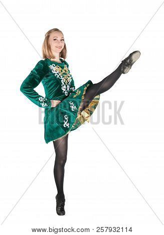 Beautiful Young Woman In Irish Dance Green Dress Jumping Isolated