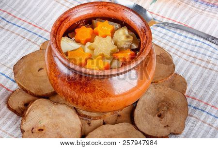 Traditional Rustic Home  Gulyas, With Raw Vegetables And Spices In Clay Pots On  Old Vintage Wooden 