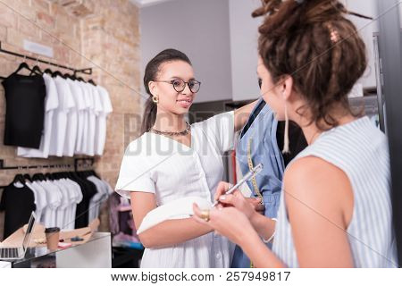 Beautiful Two Designers Mooting Over Overalls In Showroom