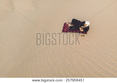 Tuareg Man Drinking Tea In A Desert