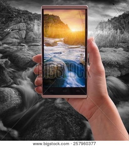 Magestic Colorful Sunrise Above The River In A Rocky Canyon On A Screen Of Smartphone Against Monoch