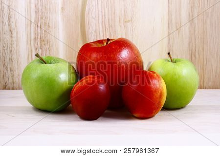 Beautifully Laid Out Fresh Summer Fruits On A Background Of Cutting Boards