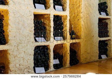 Many Champagne Bottles In A Wine Cellar