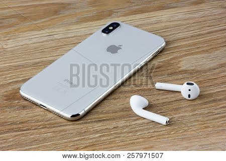 Rostov-on-don, Russia - September 2018: The Iphone 10 Lies On A Wooden Table Next To The Wireless He