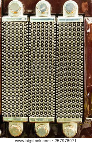 Close Up On Metal Radiator Element Detail. Agricultural Machines Vahicles Objects Concept.