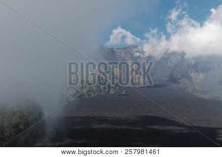 the Bove Valley flooded by clouds in Etna Park, Sicily
