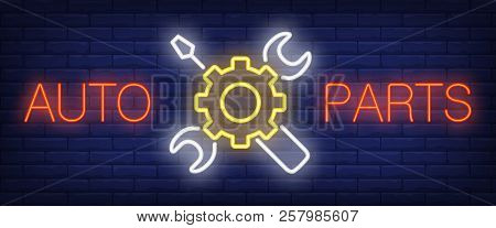 Auto Parts Sign In Neon Style. Red Lettering, Cogwheel, Wrench And Screwdriver. Night Bright Adverti
