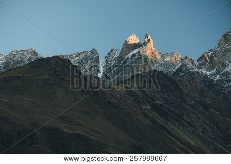 Ridge of the Caucasus Mountains. Light of the rising sun. Samegrelo-zemo Svanetii, Georgia. Art processing of photos, color toning