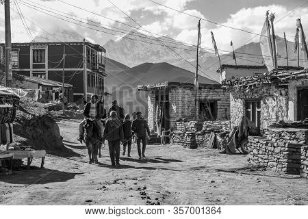 Man Leading A Horse And Riders