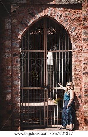 Blond Tourist Poses At The Gate Of Tomb Of Sikandar Lodi, A Ruler Of The Lodi Dynasty In Lodi Garden