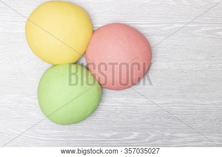 Three Colorful Red, Green And Yellow Dough On Table, Flat Lay