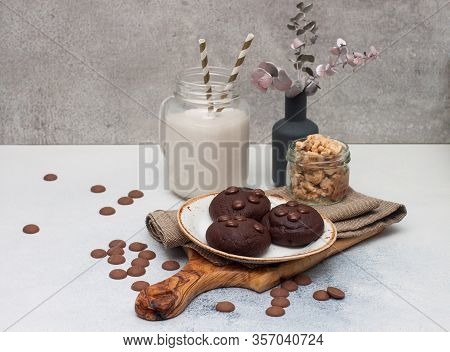 Chocolate Chip Cookies With Glass Of Milk On Gray Background