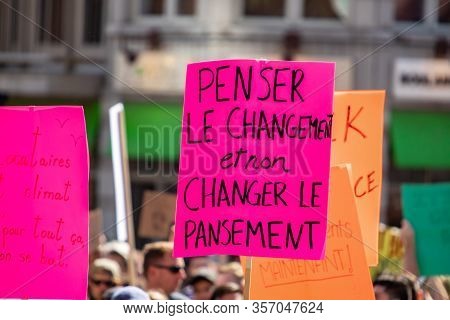 A Closeup Shot Of A Homemade French Sign Describing To Think About Real Change, Dont Just Change The