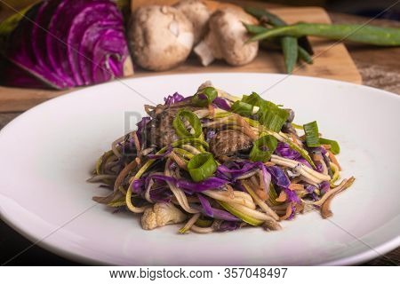 Yakisoba With Carrot Spaghetti. Low Carb Meal Over A Wooden Table