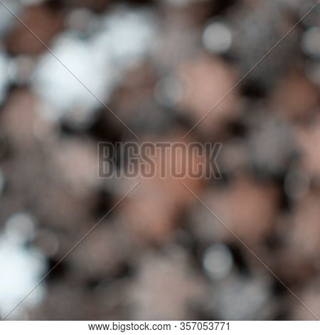 Background Made Of Orange, Grey And White Blurred Spark With Copy Spaceles