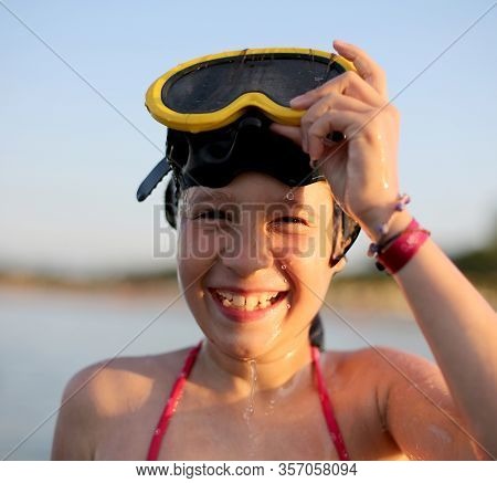 Very Happy Little Girl With Diving Mask At The Sea In Summer