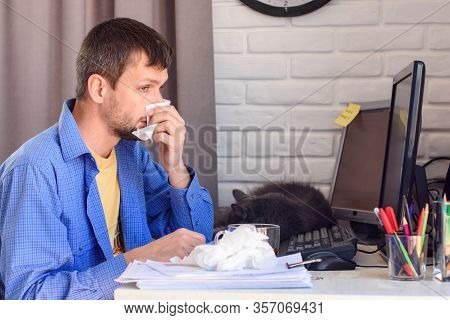 A Sick Self-employed Person Wipes His Snotty Nose With Napkins.