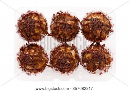 Cake Anthill On A White Background. Anthill Cake In A Plastic Container From A Supermarket.