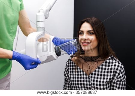 Dentist Makes X-ray Of The Dental Cavity For The Patient In Clinic