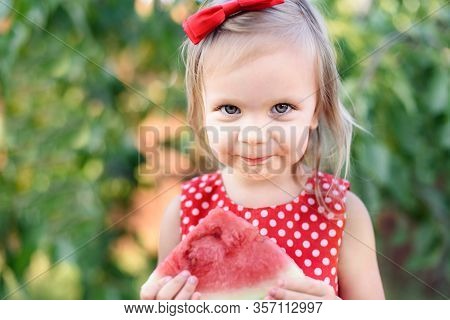 Cute Girl Eat Ripe Juicy Watermelon On Grass At Summertime