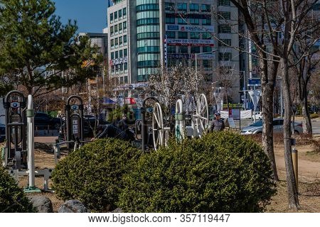 Daejeon, South Korea; March 16, 2020: Unidentified Man Doing Pushups On Exercise Equipment In Public
