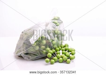 Bag Of Fresh Turkey Berry,pea Eggplants Or Turkey Berry Isolated On White Background.