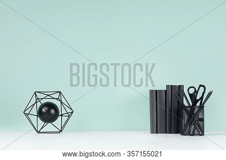 Spring Soft Students Workplace With Black Stationery, Books And Decoration Atom Statuette On Soft Li