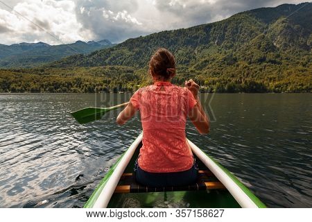 Girl Kayaking In The Scenic Bohinj Lake, Slovenia