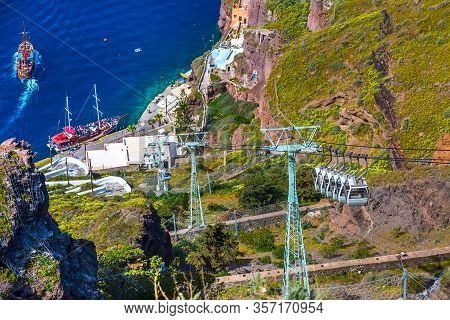 Fira, Santorini Island, Greece Panoramic View, With Cable Car Cabins From Old Port, High Volcanic Ro